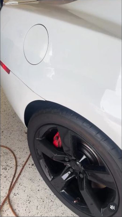 White performance car and wheel detail
